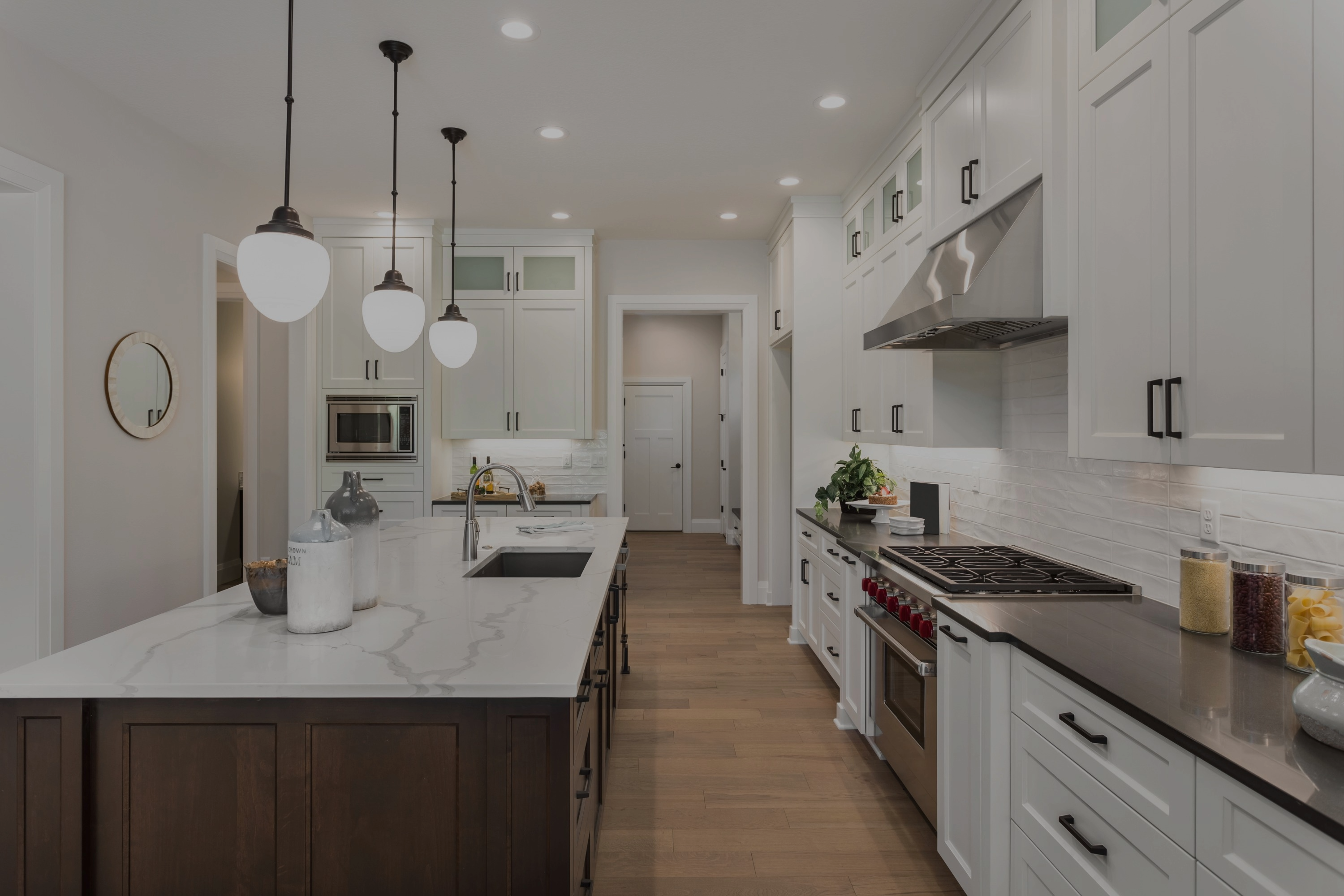 kitchen designed with new cabinets and contrasting stone countertops